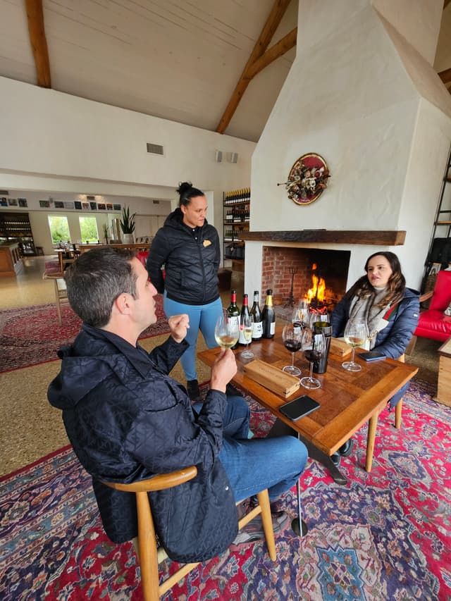 A close-up of a wine glass during a wine tasting event.